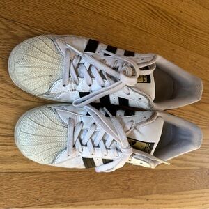 Adidas White and Black Sneakers with Gold Accents